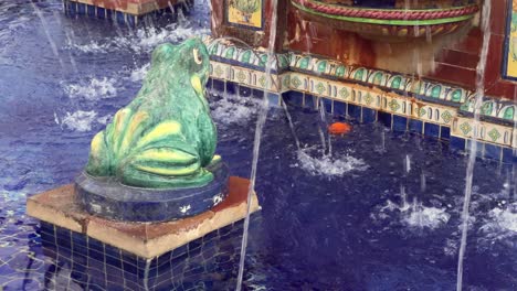 Splashing-water-animates-the-Pescaito-Fountain-in-Plaza-de-España,-the-heart-of-Vejer-de-la-Frontera,-Cadiz,-Andalusia,-Spain,-infusing-the-area-with-a-joyous-energy-akin-to-a-lively-amusement-park