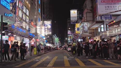Profile-view-of-local-people-waiting-for-crossing-roads-in-CTMA-Centre-of-Mong-Kok-District-in-Hong-Kong