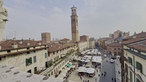 Bustling-piazza-delle-erbe,-verona-with-historical-architecture,-aerial-view