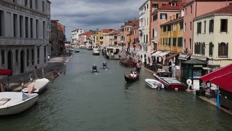 Police-officers-on-jet-skies-patrol-canal-of-Venice,-Italy