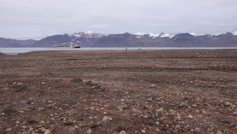 Coastline-of-Greenland-and-Cruise-Ship-in-Fjord-Water,-Wide-View