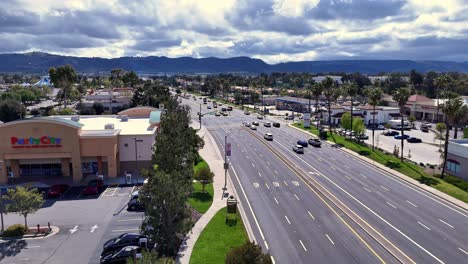 Drone-Pullback-Winchester-Road-Temecula-California-at-Party-City-With-light-traffic-flowing-near-the-Margarita-Road-Intersection