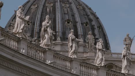 Saint-Peter's-Basilica,-adorned-with-its-iconic-dome-and-statues,-situated-within-the-Vatican