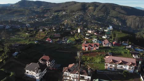 Drone-Shot-of-Village-in-Lush-Hills-of-Nuwara-Eliya,-Sri-Lanka