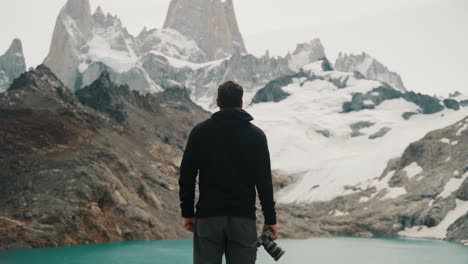 Travel-Photographer-Standing-By-The-Laguna-de-los-Tres-On-Mount-Fitz-Roy-Trail-In-Argentina