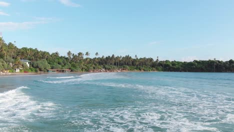 Drone-Flying-Close-to-Water-and-Rolling-Waves-at-Hiriketiya-Beach-in-Sri-Lanka
