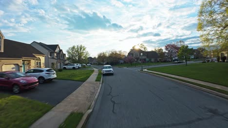 FPV-drone-flight-over-Upscale-Neighborhood-with-swimming-pool-during-spring-season