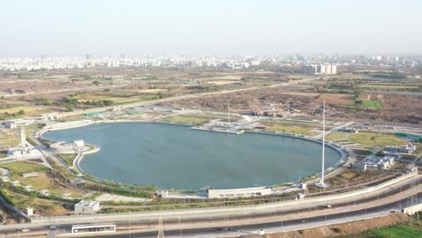 In-the-area-around-the-lake-there-are-a-lot-of-big-buildings-and-small-farms