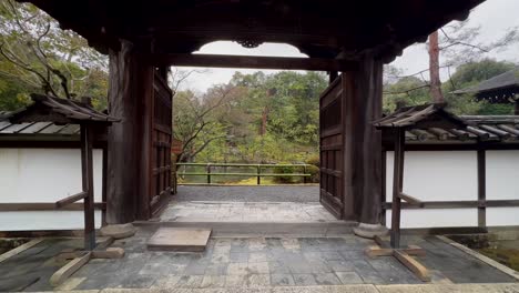 Walking-Through-Entrance-Gate-Of-Konchi-in-Temple-Revealing-Lake-On-Rainy-Day
