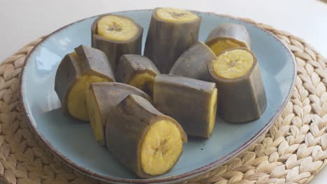 Peeling-steaming-hot-boiled-plantain-bananas,-fast-forward
