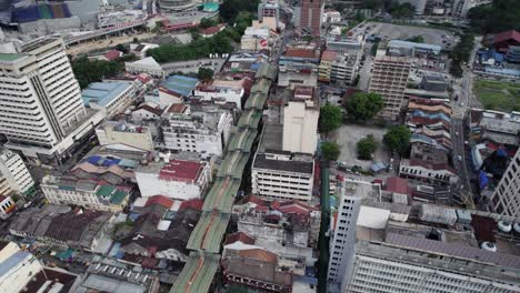 Drone-view-of-the-Iconic-Green-Dragon-Roof-of-Petaling-Street-in-Chinatown