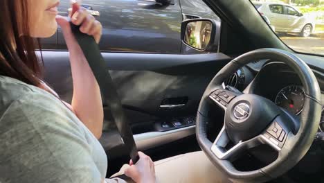 Woman-Fastening-Her-Seatbelt,-Slow-Motion
