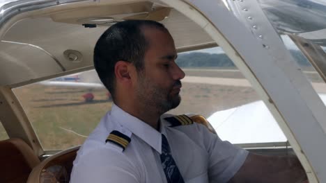 A-pilot-inside-the-cockpit-of-his-plane-checking-the-control-panel