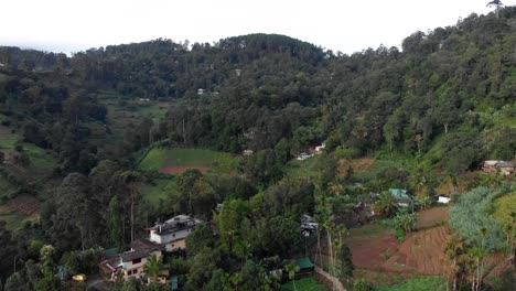 Aerial-View-of-Remote-Homes-in-Green-Mountains-in-Ella,-Sri-Lanka