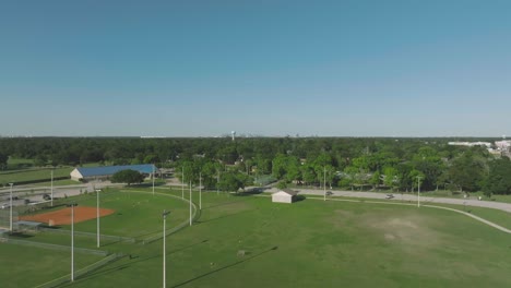 An-aerial-view-of-Clear-Lake-Park-Community-Center,-athletic-fields,-playgrounds,-and-walking-paths-in-Pasadena,-Texas