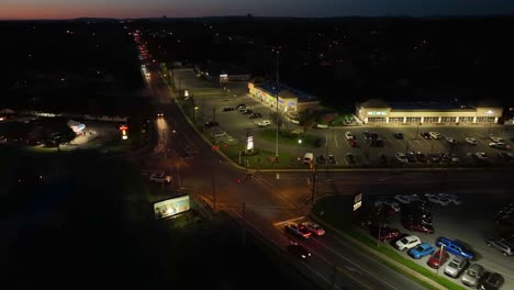 Traffic-on-road-in-american-town-at-night