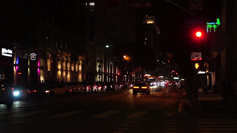 Los-Angeles-USA,-Downtown-Street-Traffic-at-Night,-Cars,-Buildings-and-Lights,-Slow-Motion