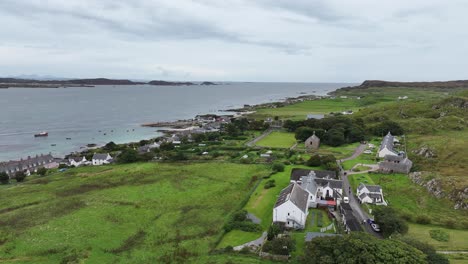 Aerial-View-of-Iona-Island,-Scotland-UK,-Green-Landscape-and-Waterfront-Homes,-Drone-Shot-60fps