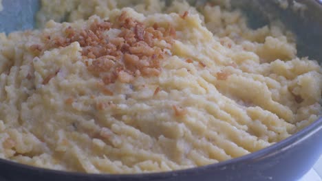 Mashed-banana-plantain-puree,-on-a-turning-table-ready-to-eat,-part-2