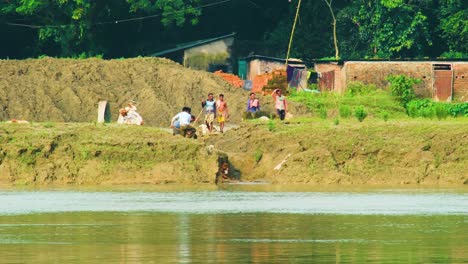 Hardworking-Laborers-Gathering-Soil-For-Brickmaking-Factory-In-Bangladesh,-South-Asia