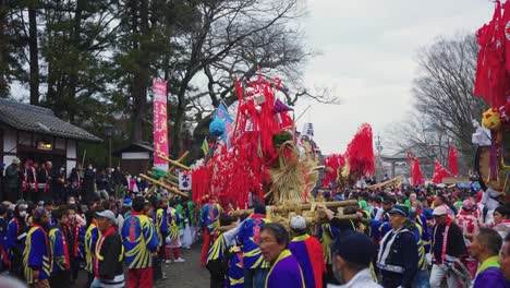 Japanese-People-at-Festival-Carrying-Year-of-the-Dragon-Floats-through-Hachiman-Shrine