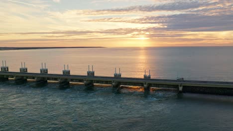 Revealing-drone-shot-of-the-Oosterschelde-storm-surge-barrier-during-sunset