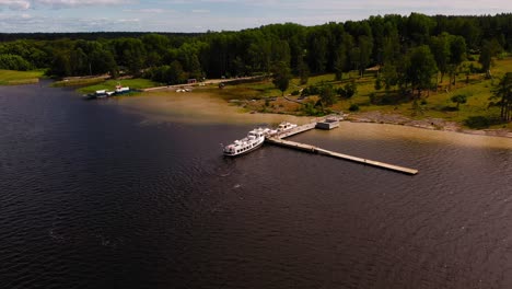 Aerial-view-of-a-small-ferry-boat-on-lake-Vanern,-sunny,-summer-day-in-Sweden