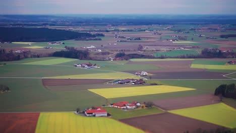 An-aerial-view-of-the-patchwork-of-fields,-towns,-forests,-and-river-banks-in-rural-Germany