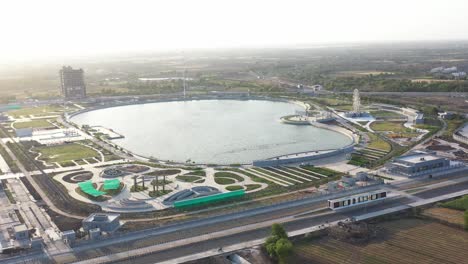 Drone-camera-moving-to-right-side-showing-pond-garden-and-small-farm