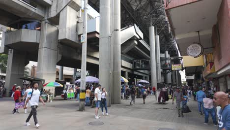 Bustling-Medellin's-Parque-Berrio-Metro-Station-flanked-by-urban-life-and-vendors