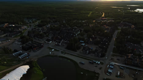 Aerial-view-circling-the-Levi-village,-sunny,-summer-evening-in-Finland