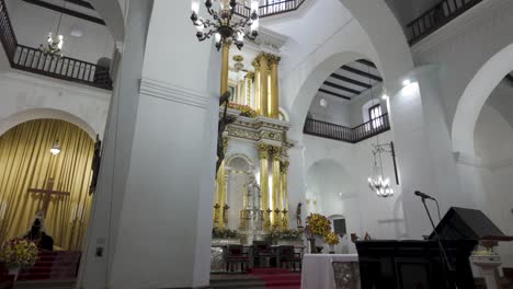 Elegant-interior-of-Basilica-of-Our-Lady-of-Candelaria-with-grand-chandeliers,-Medellin-Colombia