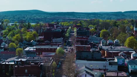 This-is-a-Mavic-3-Pro-drone-shot-using-the-70mm-lens-of-Beacon,-NY's-Main-Street-with-the-Newburgh-Beacon-Bridge-in-the-background