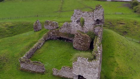 Slow-motion-aerial-orbit-of-Clonmacnoise-castle,-detailed-view