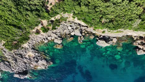 Rugged-cliffs-on-corfu-island,-greece,-overlooking-the-ionian-sea,-aerial-view