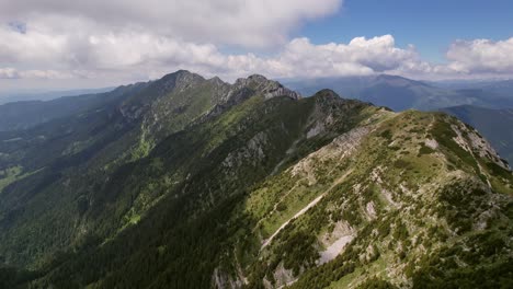 Piatra-craiului-mountain-ridge-under-a-cloudy-sky,-daylight,-aerial-view