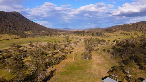 Aerial-shot-of-Alpine-Way-highway-near-Kosciuszko-National-Park-at-Crackenback-on-a-sunny-day,-New-South-Wales,-Australia