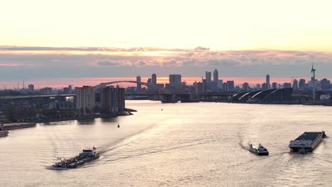 City-Skyline-Rotterdam,-The-Netherlands-At-Sunset---Aerial-Drone-Shot