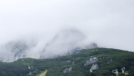 Mountain-peek-covered-in-mist-in-the-Retezat-Mountains,-Romania-Carpathians