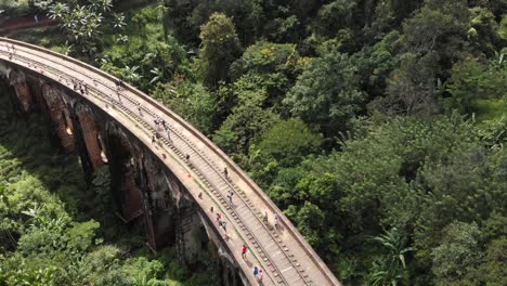 Drone-Flying-Up-Over-Nine-Arch-Bridge-in-Middle-of-Jungle-in-Sri-Lanka