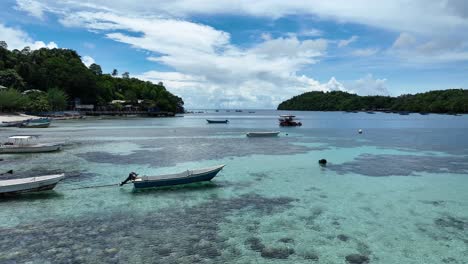 Tropical-Iboih-Beach-with-clear-waters-and-moored-boats,-Pulau-Weh,-snorkeling-hotspot