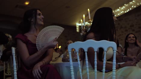 Slow-motion-shot-of-attractive-bridesmaids-listening-to-speeches-at-a-wedding