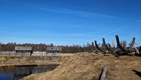 Rustic-Medieval-Scenery,-Walls-of-Old-Town-and-Boat-Construction-Site-on-Sunny-Day,-Panorama