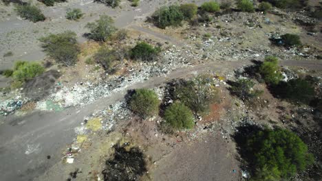 Rubbish-Scattered-in-Mulege,-Baja-California-Sur,-Mexico---Orbit-Drone-Shot