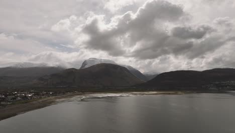 Aerial-rising-shot-of-a-snow-covered-Ben-Nevis-in-Fort-William,-Scotland