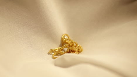 Gold-Wedding-Necklace-dropped-on-velvet-cloth