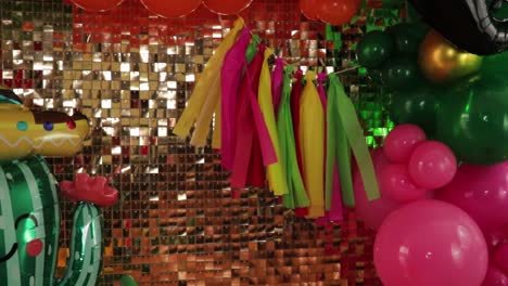 Cinco-de-Mayo-Themed-Decoration-Surrounded-by-Balloons-and-Golden-Backdrop