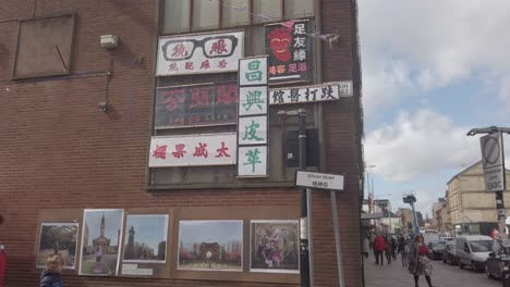 Wide-shot-of-fake-street-signage-and-advertisement-at-the-Hong-Kong-Market-in-Glasgow