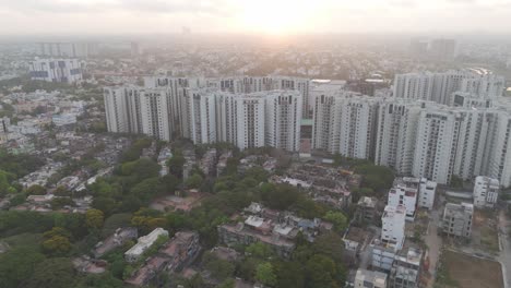 An-enchanting-aerial-perspective-of-Chennai,-showcasing-the-city's-architectural-beauty-and-dynamic-atmosphere-against-a-backdrop-of-drifting-clouds