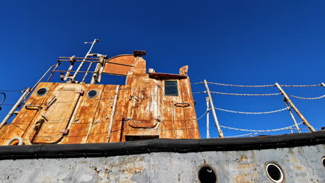 Beautiful-contrast-between-train-wreck-and-clear-blue-sky,-rusty-locomotive-of-Latvia
